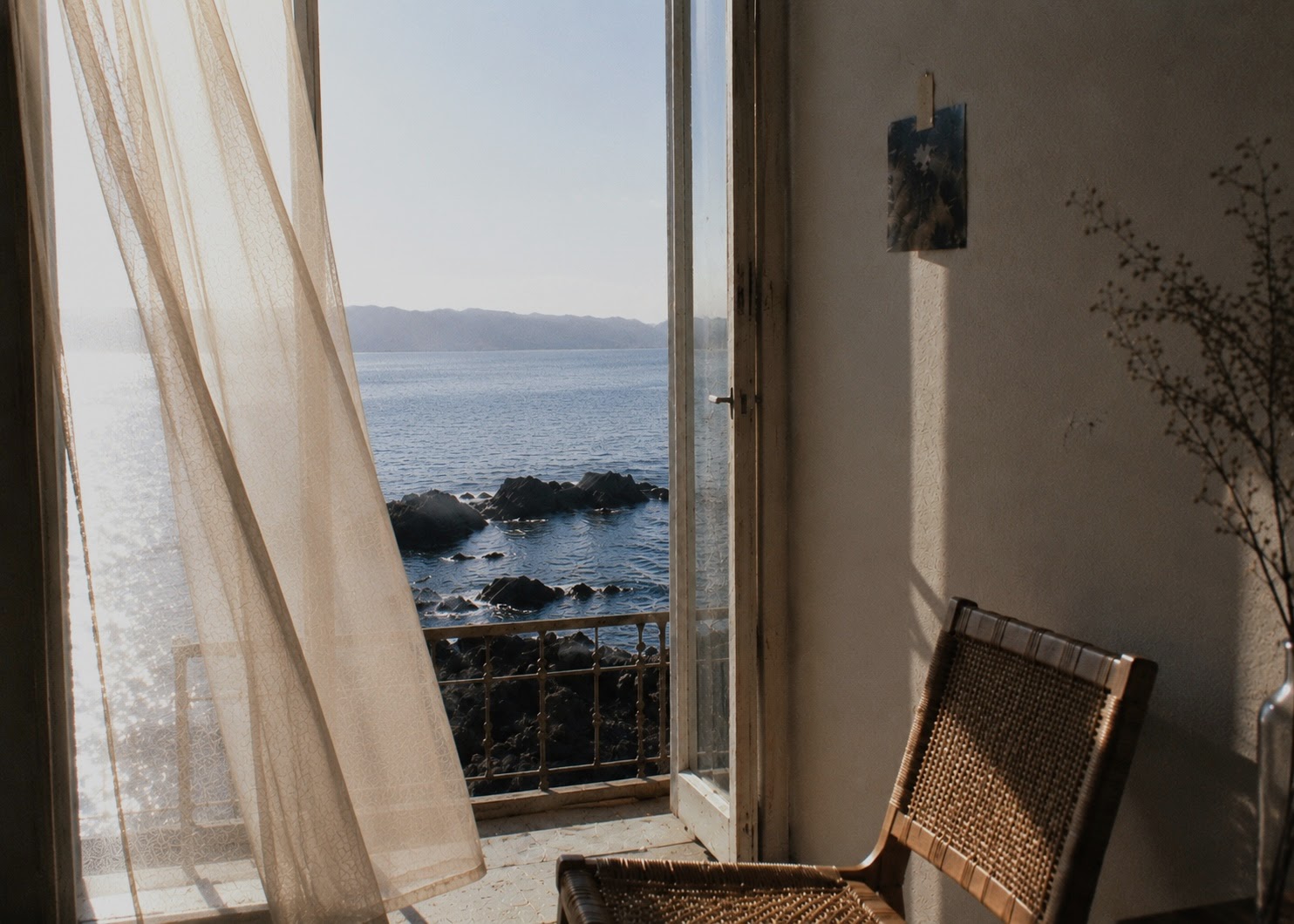 Sunlit window overlooking the sea